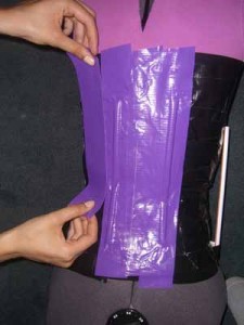 Layer two is shown in purple. This layer is vertical and goes over the drinking straws on layer one.